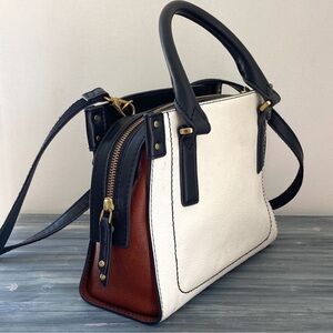 Fossil crossbody bag off-white leather black brown color block zip top satchel